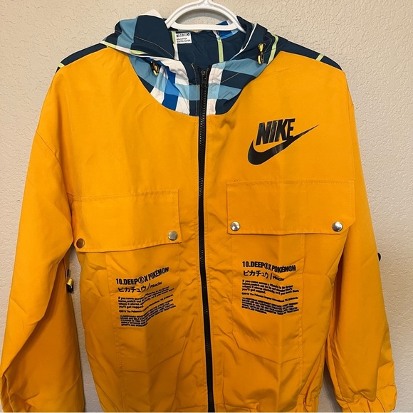 Nike 10 Deep X Pokemon Pikachu Trainer Yellow Windbreaker Jacket Medium - Picture 2 of 13